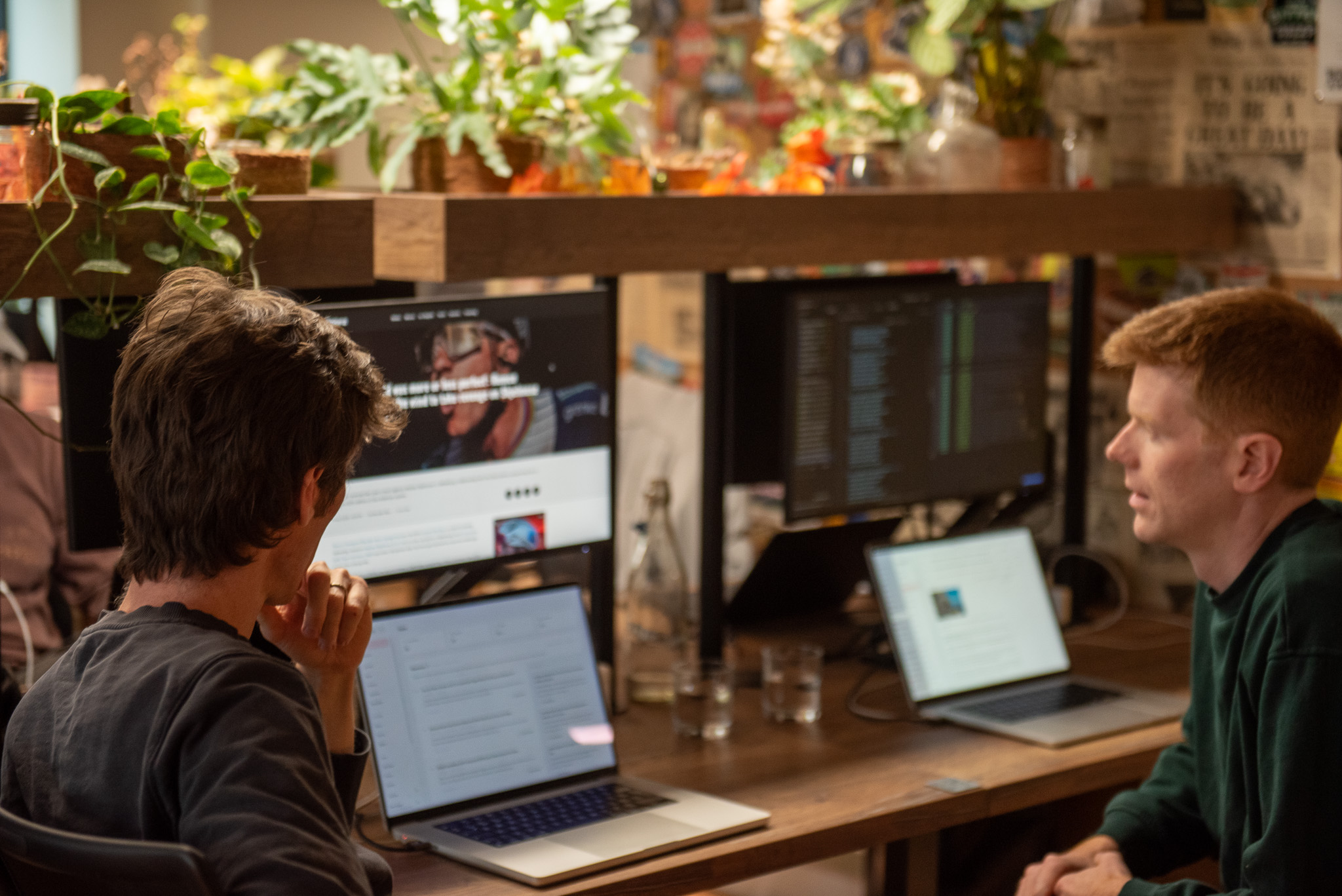 Velora's founding team reviewing articles at their desk